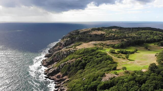 Forward going drone view of Kullaberg from high up in summer