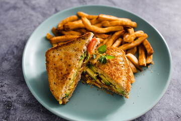 plant-based food,  vegan avocado tomato and dairy-free cheese sandwiches with french fries