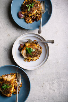 Moroccan spiced chicken thighs, served with giant couscous,dates and chickpeas.