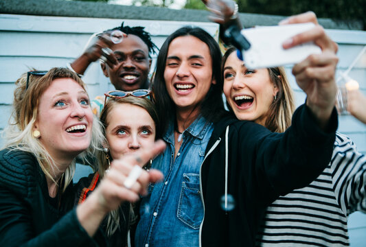 Young group taking a selfie on a summer evening