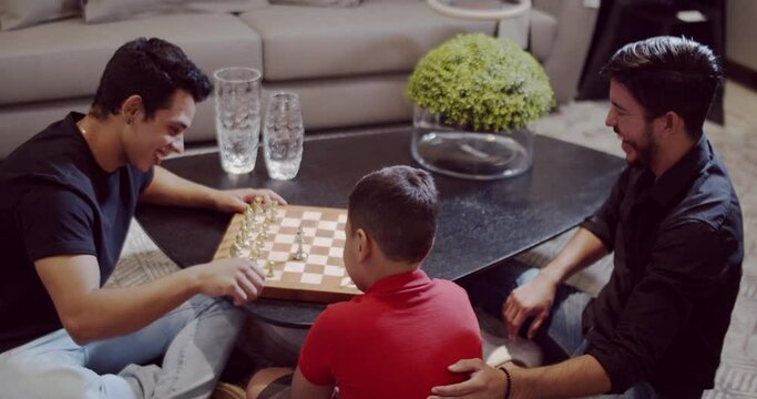 Homosexual Latino family at home with adopted son. 4K.