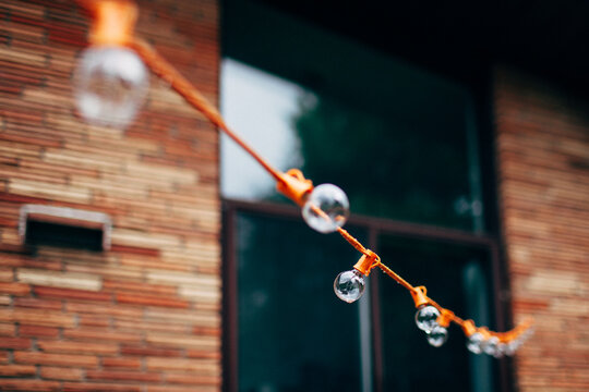 string lights on a house in summer