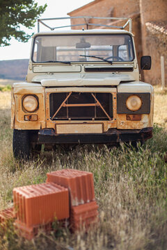 57/5000 Old and abandoned vehicle in a town of Soria, Spain.