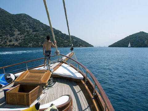 Man on the deck of a traditional Turkish sailing Boat - Gulet