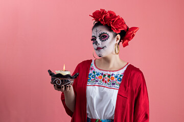 A young woman disguised as a catrina