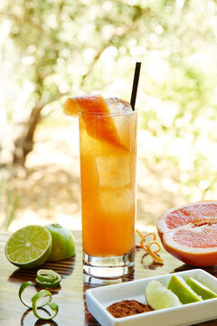 Rum cocktail drink with cinnamon syrup, lime, grapefruit and absinthe