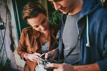 Young Couple is Using Camera