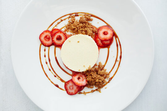 Fromage blanc cheesecake with organic strawberries, graham cracker streusel, balsami