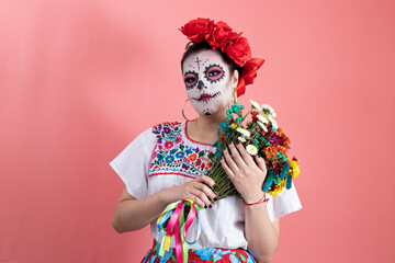 A young woman disguised as a catrina