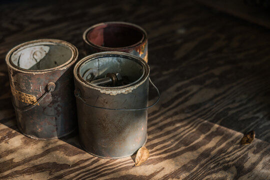 Old Vintage Paint Cans with collections of Harware and Nails