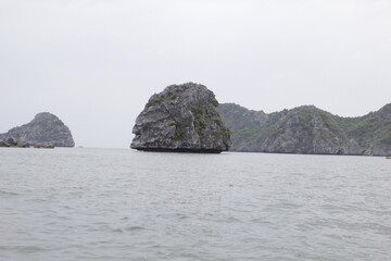 HA LONG BAY, VIETNAM - NOVEMBER 13, 2018: Halong Bay, Vietnam. Unesco World Heritage Site. Traditional tourist boats.