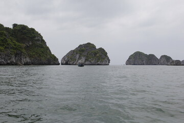 HA LONG BAY, VIETNAM - NOVEMBER 13, 2018: Halong Bay, Vietnam. Unesco World Heritage Site. Traditional tourist boats.