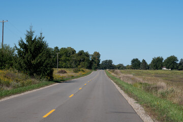 Empty road in rural Mid - West