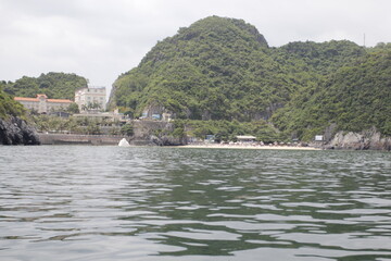 HA LONG BAY, VIETNAM - NOVEMBER 13, 2018: Halong Bay, Vietnam. Unesco World Heritage Site. Traditional tourist boats.