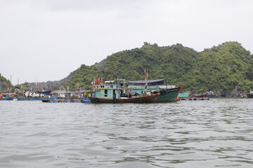 HA LONG BAY, VIETNAM - NOVEMBER 13, 2018: Halong Bay, Vietnam. Unesco World Heritage Site. Traditional tourist boats.