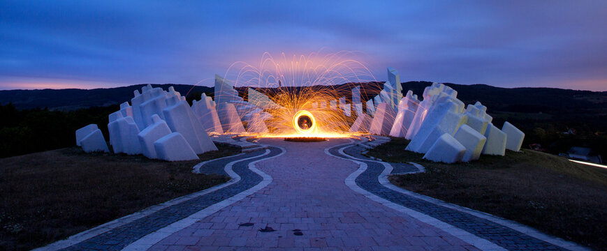 Spinning sparkle poi at communsitic monument