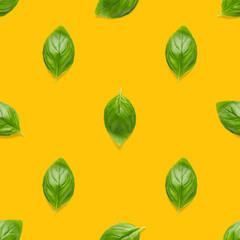 Italian Basil leaf herb seamless pattern on orange background, Creative seamless pattern made from fresh green basil flat lay layout.