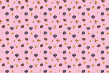 Background from Fresh figs. Food Photo. Creative set of the whole and sliced figs on a pink background, Modern fig fruits background.