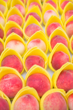 Juicy peach group in box in market