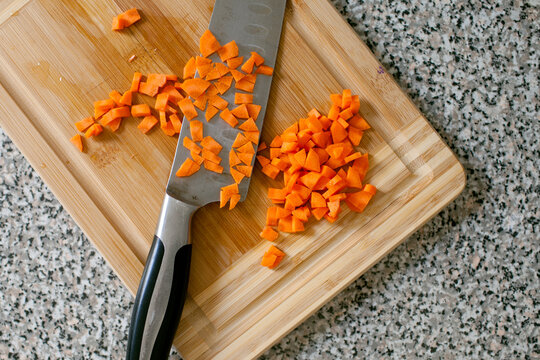 Chopped carrots on cutting board