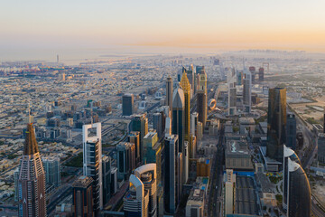 Sunrise aerial view of futuristic modern skyscrapers on Sheikh Zayed Road
