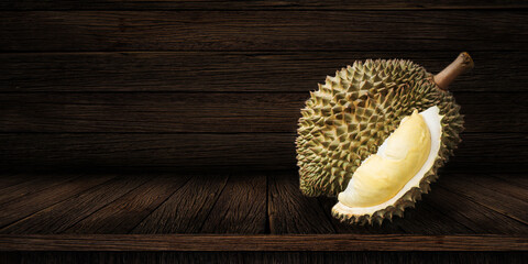 Durian riped and fresh, Durian peel with yellow color on old wood background. king of fruit from...