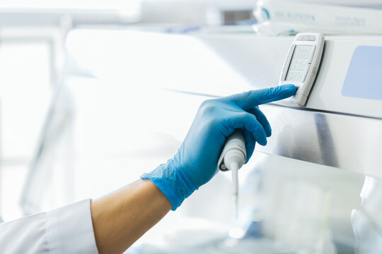 Scientist Using a Laboratory Timer