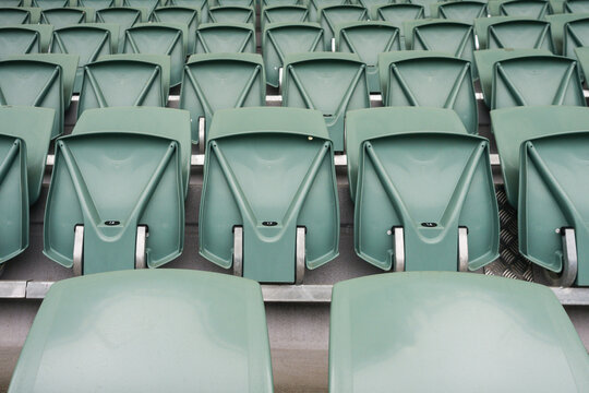 stadium seats, empty, except for that bit of gum on seat 17