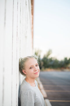 Teanager leaning on wall