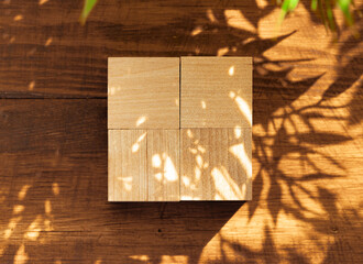 Groupped wooden square blocks on dark wooden table