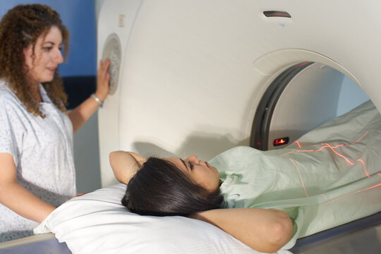 Female patient and technician getting ready for tomography
