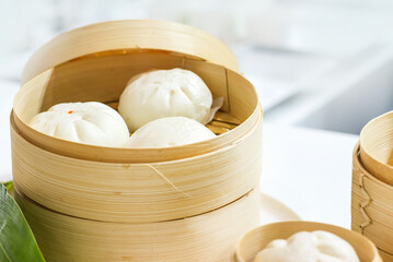 Chinese dumpling steamed buns, Steamed bun served in wooden basket
