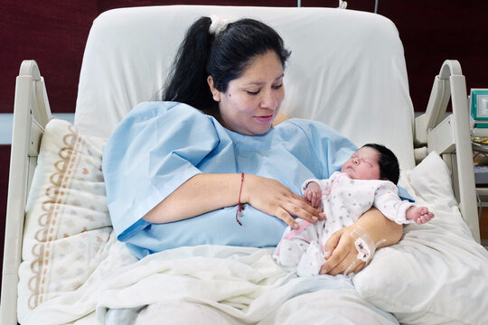 Baby mommy looking lovingly at her baby