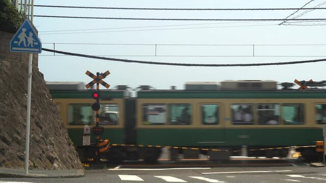 Railroad crossings overlooking the sea and passing trains