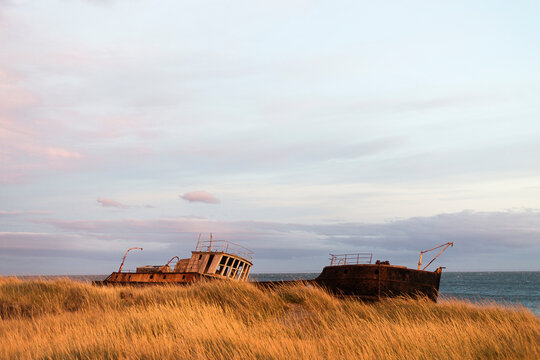 Shipwreck stranded on the shore in Strait of Magellan