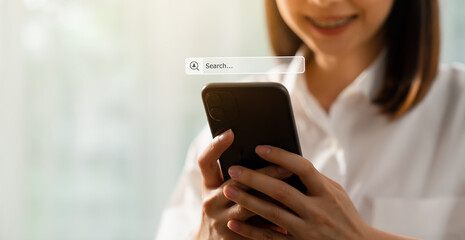 Smile woman hand using smartphone and press screen to search Browsing on the Internet online.