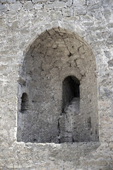Fototapeta na wymiar Windows in the walls of the ancient stone Akkerman fortress in Ukraine.