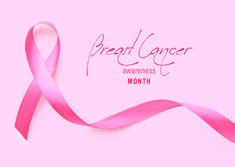 Pink ribbon with text '"Breast cancer awareness month" on color background