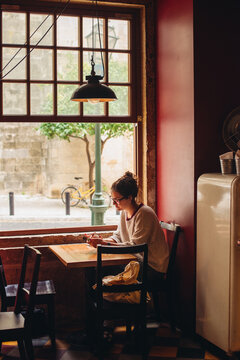 Girl sitting in a cafe