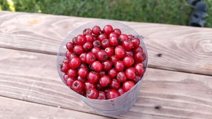 cherries in a basket on wooden table