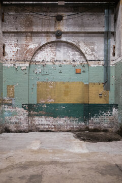 Old bricked up archways in delapidated warehosue