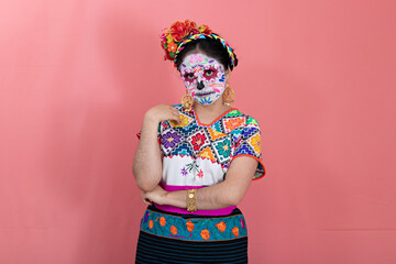 A young woman disguised as a catrina
