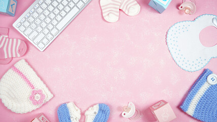 Baby nursery clothing mom bloggers desktop workspace with pink and blue accessories on stylish pink textured background. Top view blog hero header creative composition flat lay. Negative copy space.
