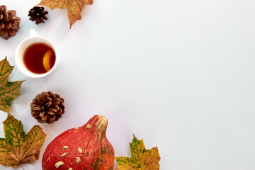 Autumn composition. Frame made of Pumpkins,dried leaves and pine cones on white background. Template autumn, fall, halloween, harvest thanksgiving concept. Flat lay, top view, copy space background