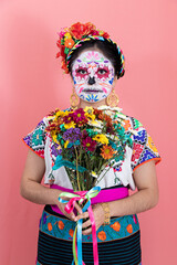 A young woman disguised as a catrina