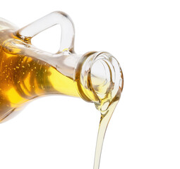 Pouring of fresh olive oil from bottle on white background