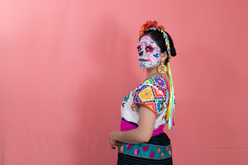 A young woman disguised as a catrina