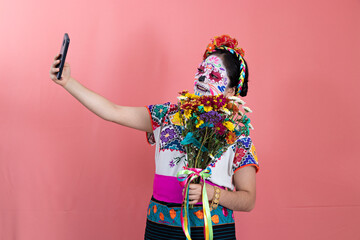 A young woman disguised as a catrina