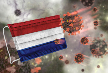 Face mask with flag of Netherlands, defending coronavirus - 379805145