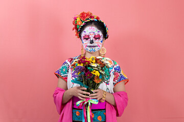 A young woman disguised as a catrina